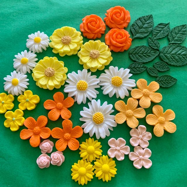 Bright mix of orange, yellow, white and pink sugar flowers